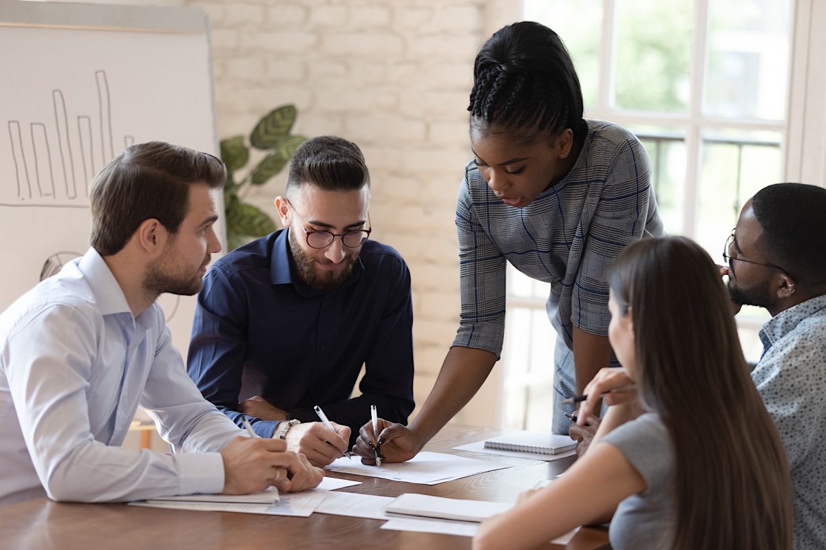 Group of colleagues discussing effective ways how to make the most of their breaks during workday